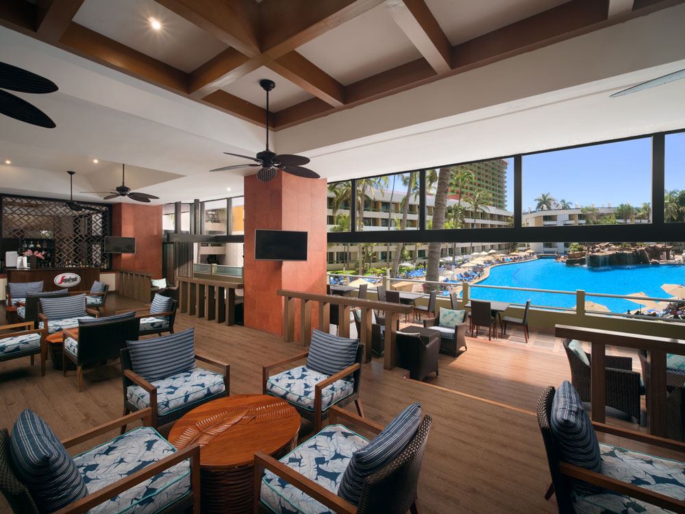 lounge with tvs poolside
