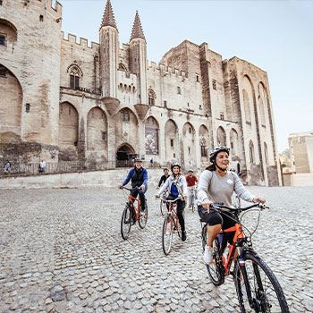family riding bikes in europe