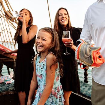 family sailing with fancy drinks