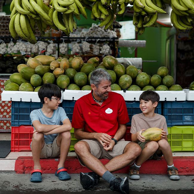 kids and disney adventure guide shopping for fruit